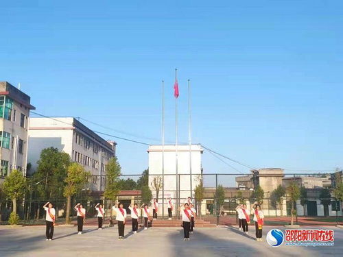 两校共燃爱国情 洞口县石江镇中学与潮安县彩塘中学爱国主题升旗仪式纪实